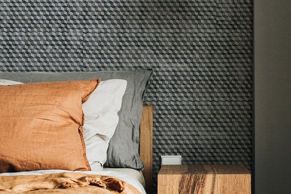 Black and white wall art behind a bed