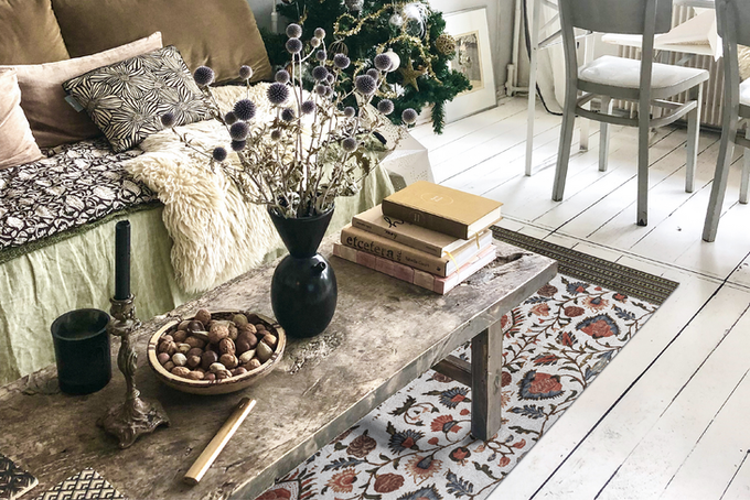 Decorative rug in well-lit living room surrounded by elegant décor