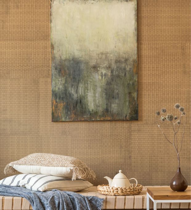 A brown Tatami-style wallpaper on a living room wall with an abstract picture