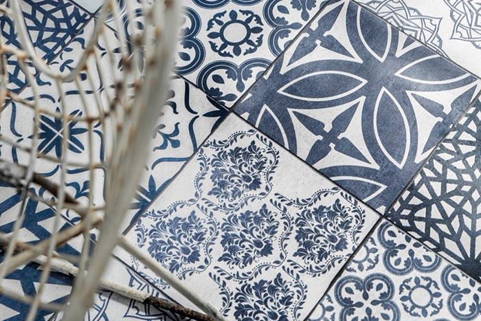 Close up image of blue and white tiles, each with a different pattern