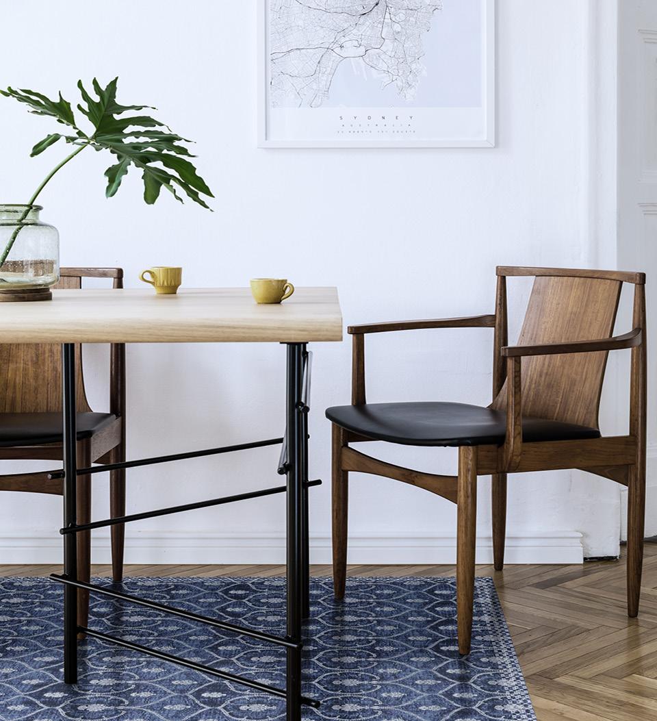 An indigo blue patterned rug under a dining room table