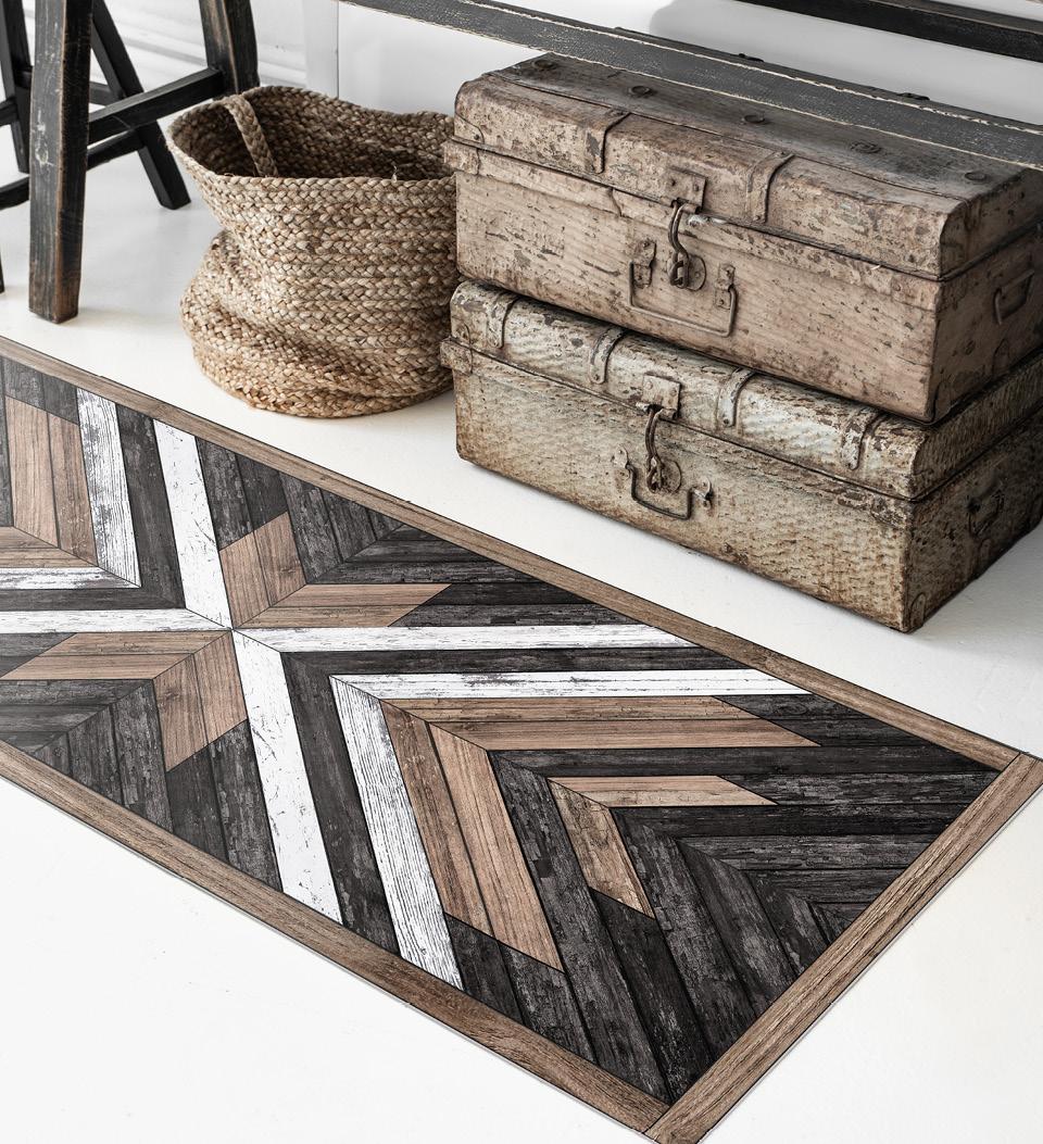 A wooden-looking rug with stripes in different tones like dark and light wood