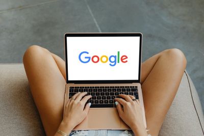 An open laptop showing Google's logo
