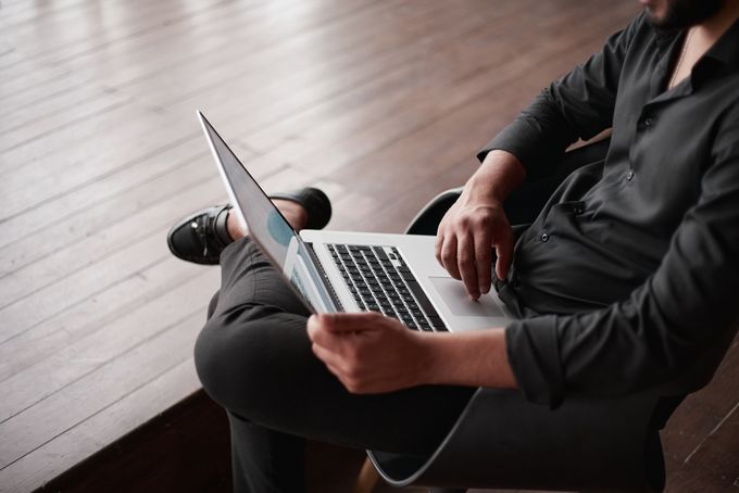 Person using laptop on their lap