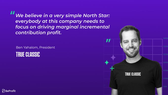 a man standing in front of a purple background