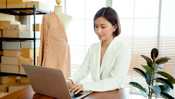 Woman using a laptop at a desk