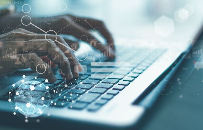 A person at a computer analyzing data