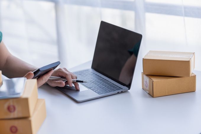 Close up of Hand SME entrepreneur working at home, part of an e-commerce team, online sales.