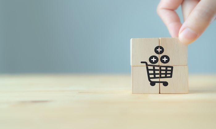 A trolley with plus symbols drawn onto four wooden blocks