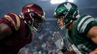 a couple of football players standing next to each other