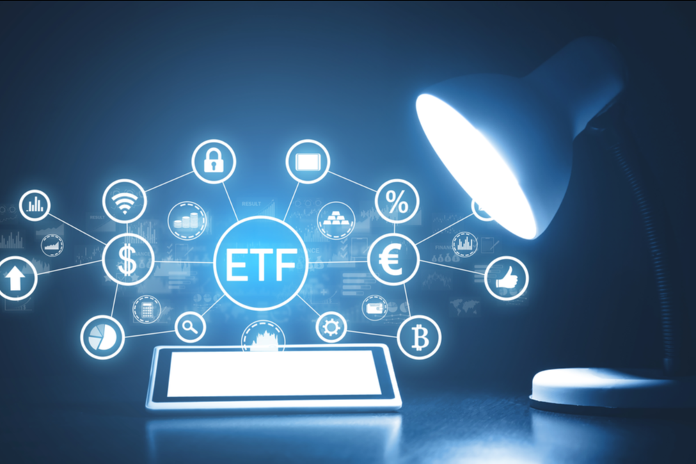 A standing lamp illuminating icons, and the letter, of ETFs