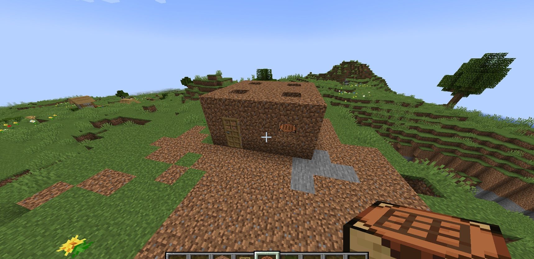 a screenshot of a small building in the middle of a field
