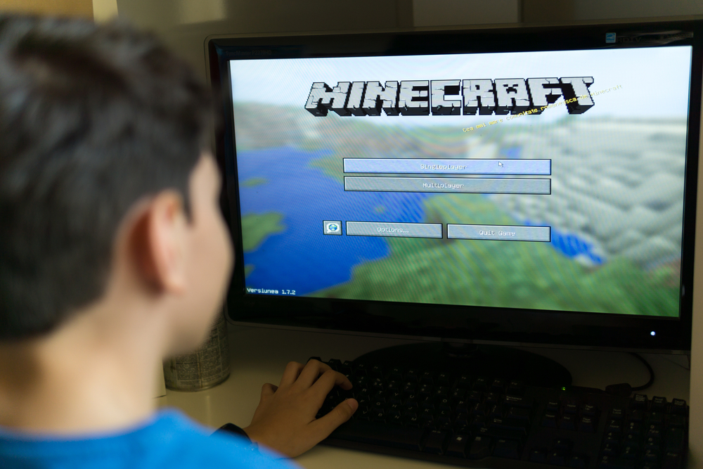 Child installing mods onto his Minecraft game for a better experience