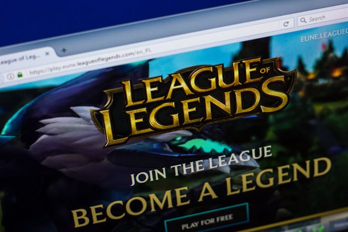 A computer screen open on the League of Legends website, on a landing page featuring a call to action to join the league.