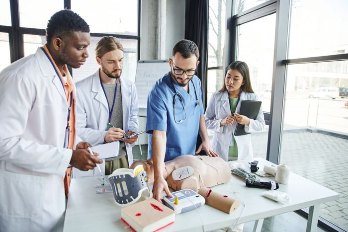 A group of doctors following corporate healthcare training best practices.