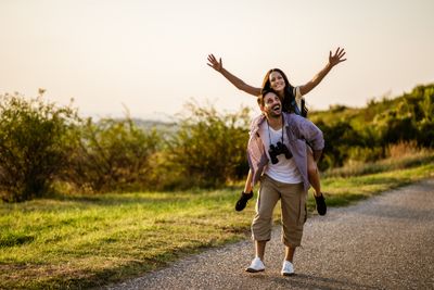 Happy couple hiking in the mountains