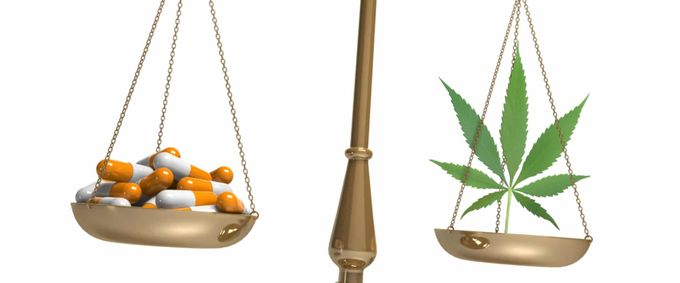 Scale unevenly balanced between pills and cannabis leaves