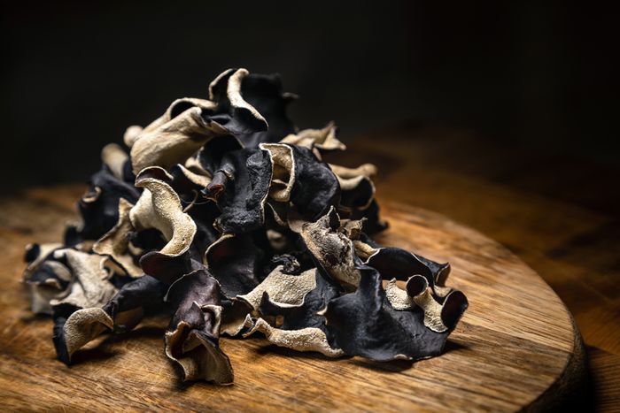 Dried Wood Ear fungus harvested and collected on wooden board