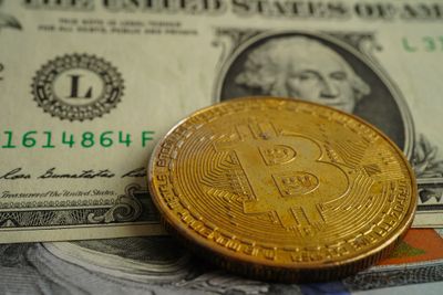 Bitcoin on a dollar bill