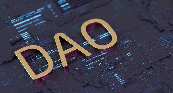 DAO in gold letters on a technological background