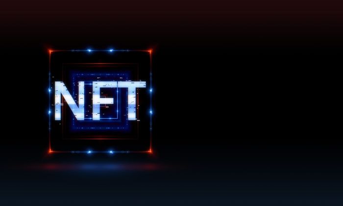 The letters 'NFT' displayed in colour on a black background