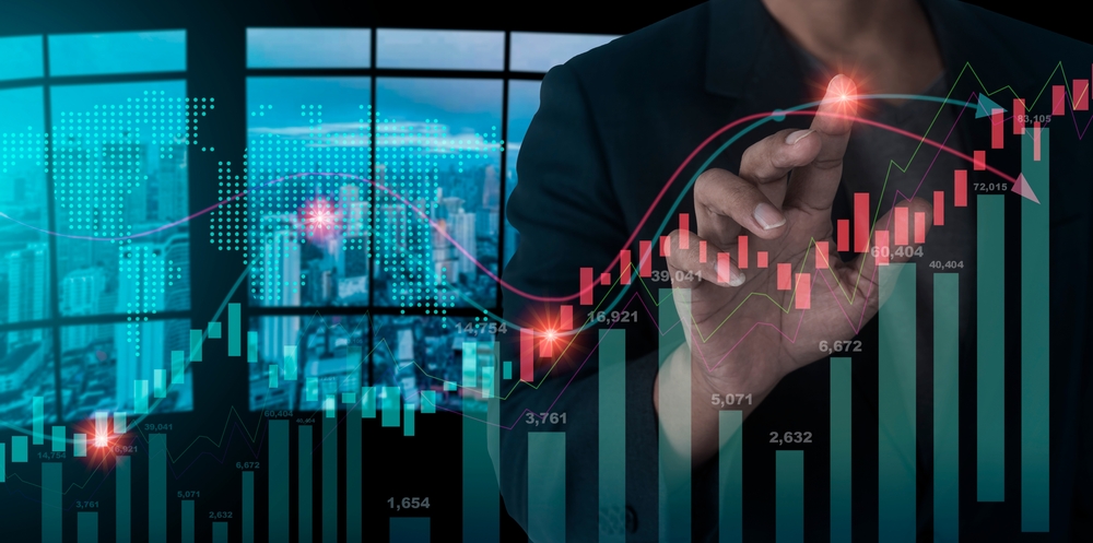 A businessman/stock broker touching a point on a stock market graph Preview Image