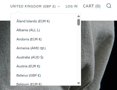Screenshot of The Great Divide's different currency options as an example of using Shopify's Basel theme