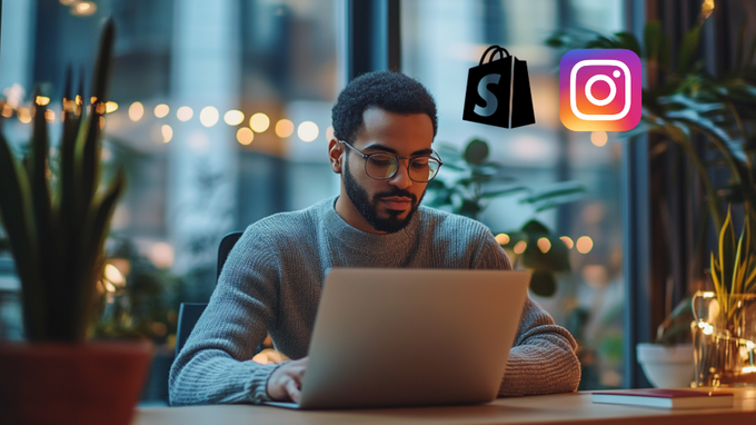 a man sitting in front of a laptop 