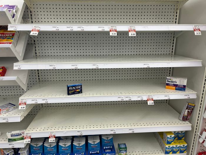 Empty shelves in a grocery store showing that products are out of stock