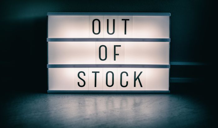 A lighted sign that says out of stock