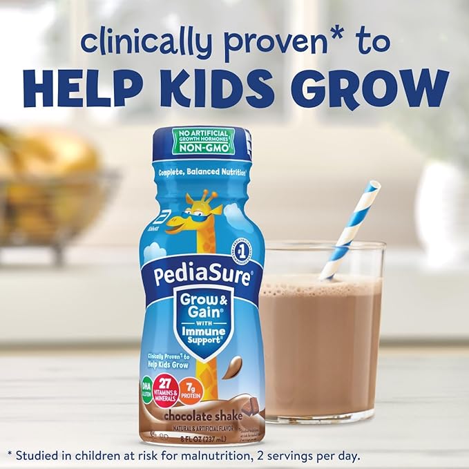 a bottle of pediasure milk next to a glass of milk