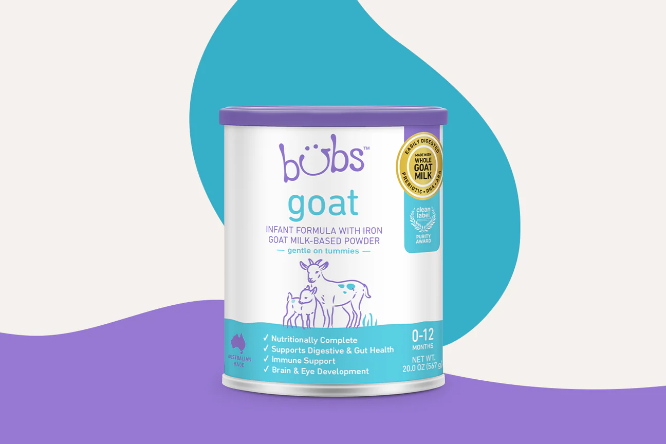 a can of baby's goat milk on a purple and blue background