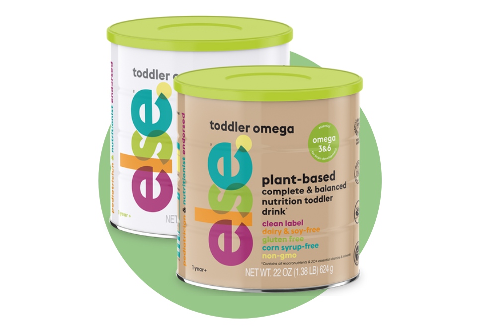 two cans of toddler's omega on a green background