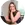 a woman sitting in front of a laptop computer