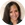 a woman with long brown hair is smiling