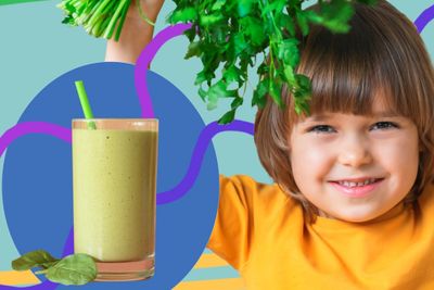 a little girl holding a green smoothie next to a green leafy plant