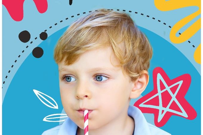 a young boy drinking a straw with a straw in his mouth