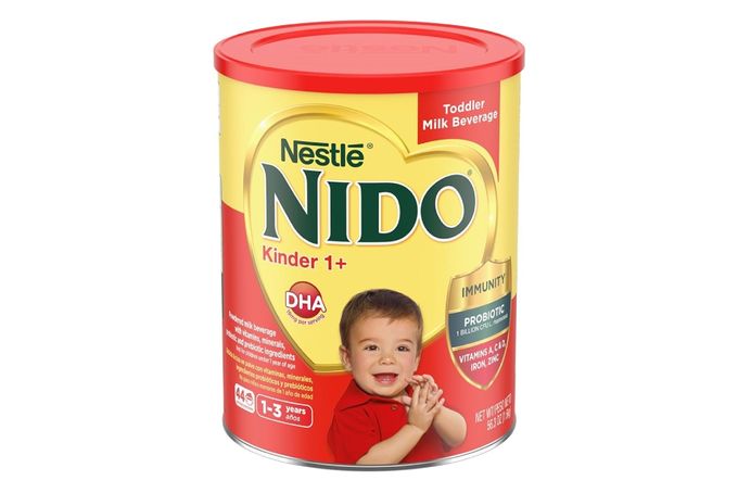 a can of nestle nido infant formula on a white background