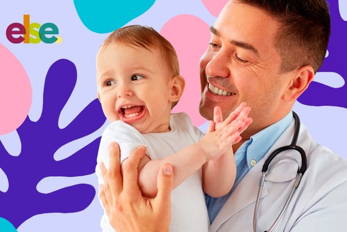a man holding a baby in his arms