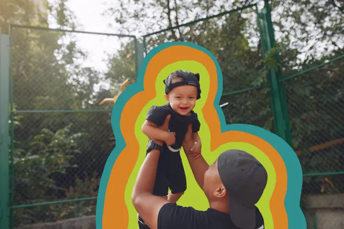 a man holding a small child in his arms