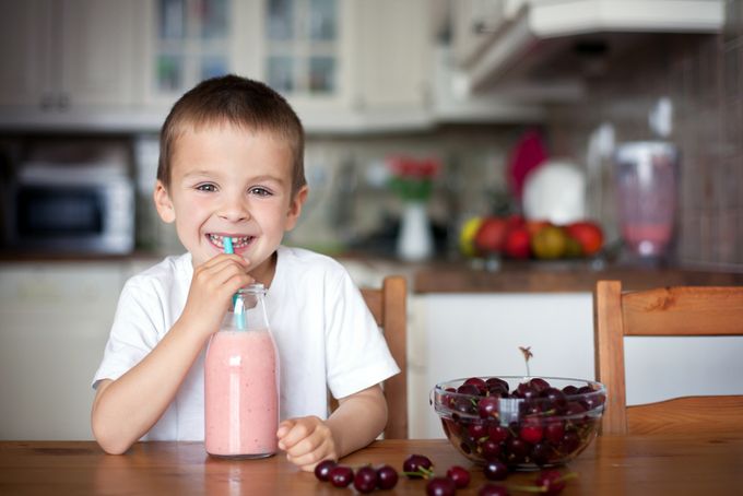 A kid that's a picky eater drinking a protein shake.