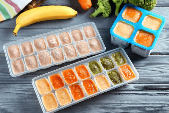 a couple of plastic containers filled with food
