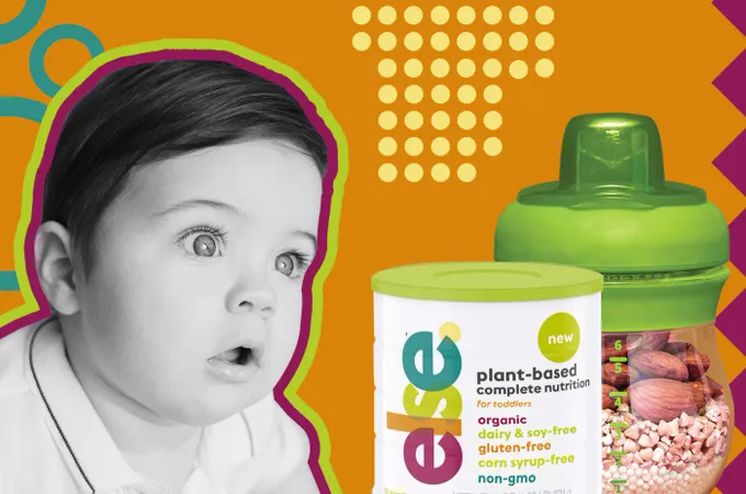 a baby looking surprised next to a jar of beans