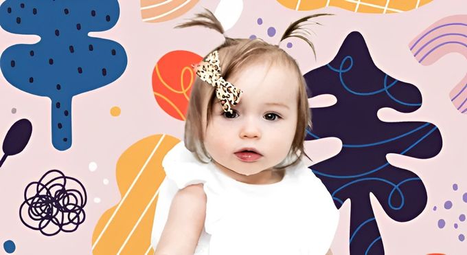 A little girl with a bow in her hair.