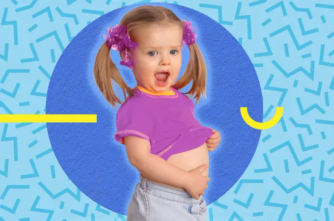 a little girl with a pink flower in her hair