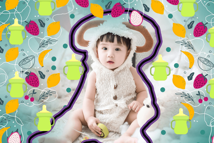 a baby wearing a sheep costume sitting on a blanket