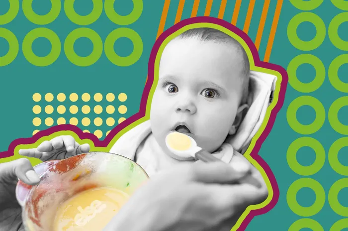 a baby is being fed with a spoon