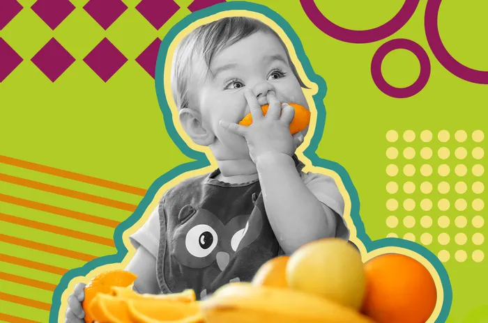 a young child eating a banana and orange