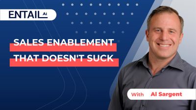 a smiling man in a gray shirt with the words sales enablement that doesn '
