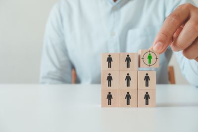 Wooden cube blocks focused on target customer.